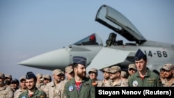 Spanish pilots and soldiers stand in front of a Spanish Air Force Eurofighter Typhoon jet at Bulgaria's Graf Ignatievo airbase in Bulgaria earlier this year. 
