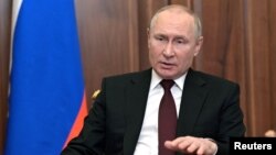 Russian President Vladmir Putin delivers a video address on the Ukraine crisis on February 21. 