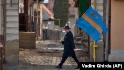 An ethnic Hungarian Szekler arrives to attend Hungarian national holiday celebrations in Targu Secuiesc, Romania, in 2013. 