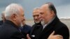 Iran's Foreign Minister Mohammad Javad Zarif, left, greets by Lebanese Hezbollah lawmaker, Ali Ammar, upon his arrival at Rafik Hariri Airport, in Beirut, Lebanon, Sunday, Feb. 10, 2019. Zarif said his country is ready to cooperate with the new Lebanese g