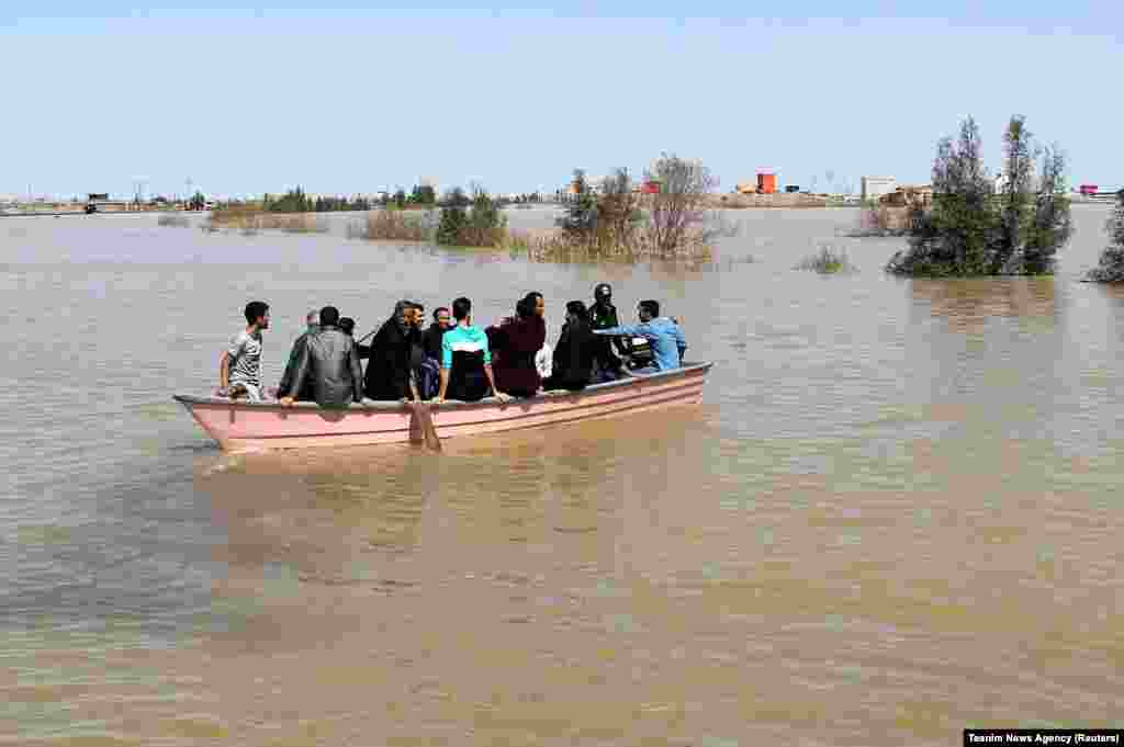 A boat carries residents of Golestan Province on March 24.