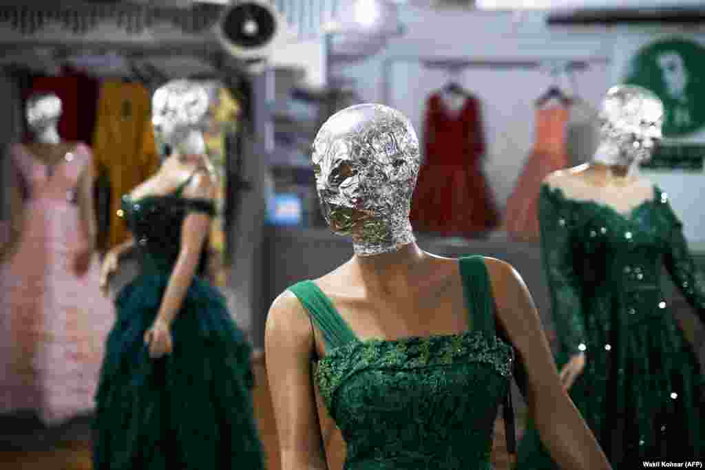 After: Tinfoil-wrapped mannequins in a Kabul clothing store in July 2024. Following the Taliban’s August 2024 morality law that also forbade depictions of animate beings, many shop owners began concealing mannequin faces.