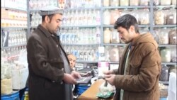 With Their Economy Close To Collapse, Some Afghans Switch To Iranian Currency