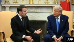 U.S. President Donald Trump (r) meets with French President Emmanuel Macron at the White House.