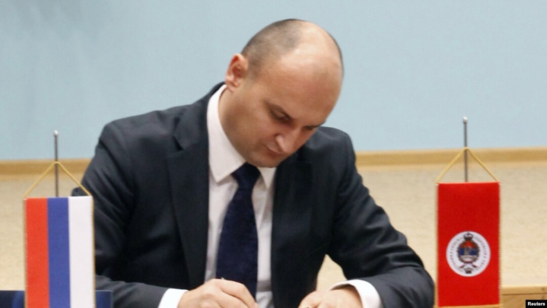 Aleksandar Dzombic attends his swearing-in ceremony