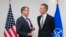 NATO Secretary-General Jens Stoltenberg (right) speaks with U.S. Defense Secretary Ash Carter at the start of a NATO defense ministers meeting in Brussels on October 8.