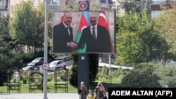 A large billboard featuring images of Turkish President Recep Tayyip Erdogan (left) and Azerbaijani President Ilham Aliyev in Ankara (file photo)