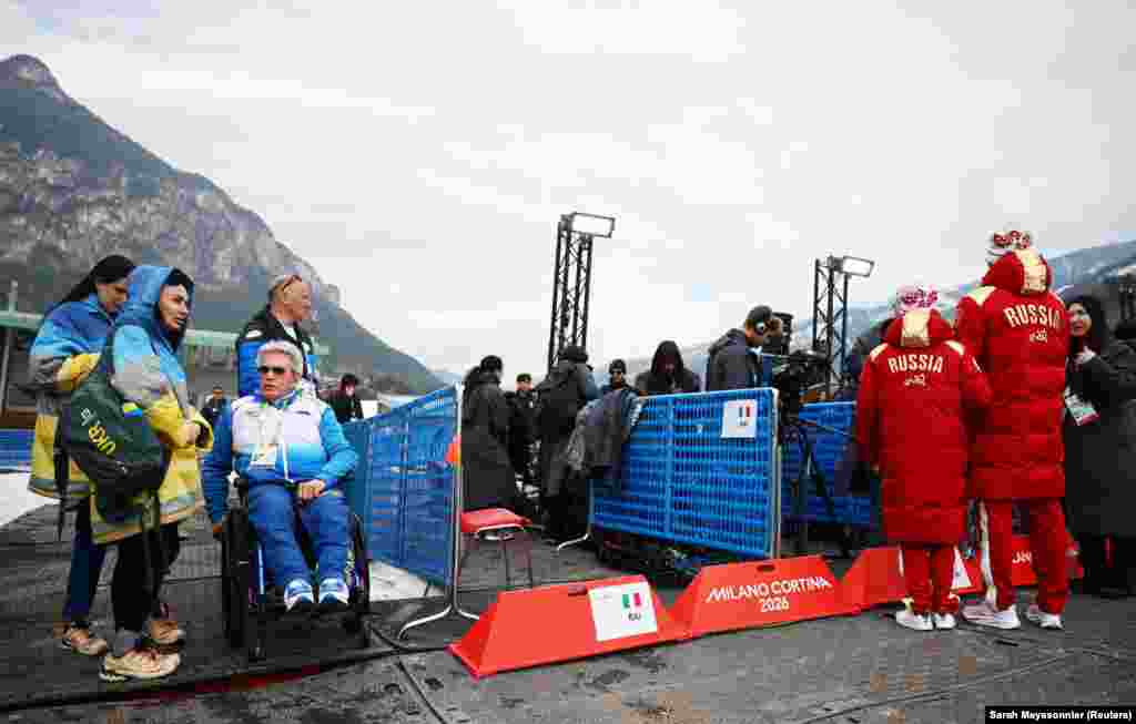 Members of the Ukrainian paralympic team (left) seen near Russian athletes during the Milano Cortina 2026 Winter Paralympic Games on March 10.