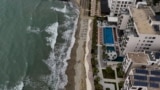 Booming tourism and climate change threaten Albania's coast