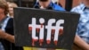 Protesters gather outside the Toronto International Film Festival (TIFF) to protest Russians At War, a documentary about Russian troops fighting in Ukraine, in Toronto on September 10.