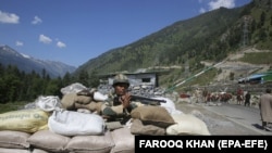 An Indian soldier stands guard at check post along a highway leading to Ladakh, at Gagangeer, 81 kilometers from Srinagar, the summer capital of Indian Kashmir, on June 17.