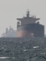 FILE PHOTO: Tankers sail in the Gulf, near the Strait of Hormuz