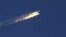 Turkey -- A still image made available on 24 November 2015 from video footage shown by the HaberTurk TV Channel shows a burning trail as a plane comes down after being shot down near the Turkish-Syrian border, over north Syria, 24 November 2015.