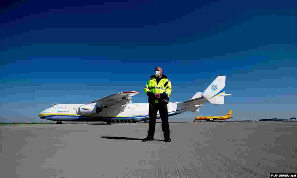 A masked security guard in front of the one and only Antonov An-225 cargo plane after it flew an order of 10 million face masks from China to Germany on April 27.