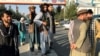 AFGHANISTAN -- A member of Taliban (Center) stands outside Hamid Karzai International Airport in Kabul, Afghanistan, August 16, 2021.