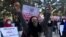 Afghan Solidarity members hold posters and chant slogans as they stage a protest against the stoning of Rukhshana in the capital Kabul in November.
