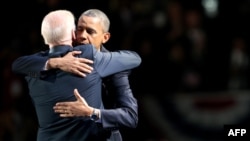 Reelected U.S. President Barack Obama and Vice President Joe Biden embrace after his victory speech on election night at McCormick Place in Chicago.