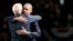 Reelected U.S. President Barack Obama and Vice President Joe Biden embrace after his victory speech on election night at McCormick Place in Chicago.
