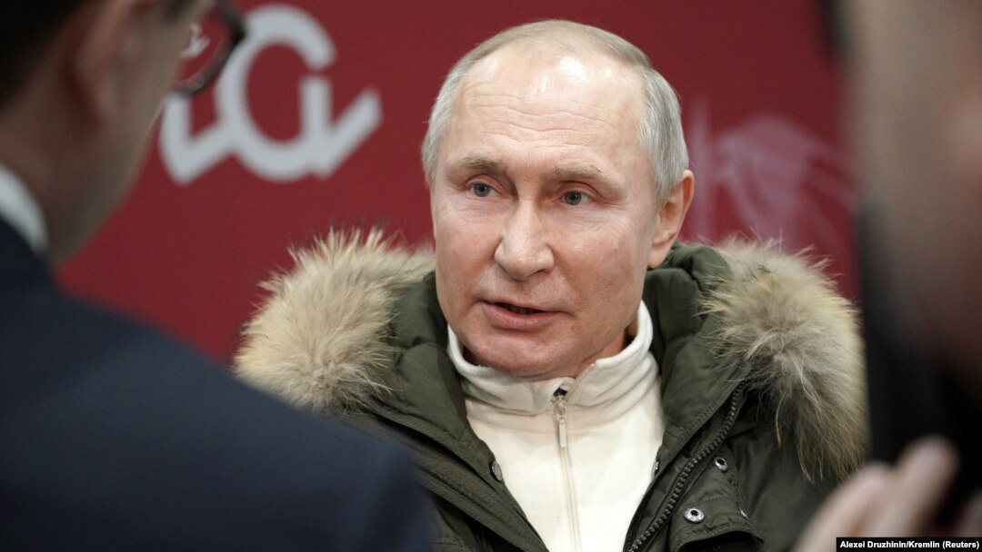 Russian President Vladimir Putin attends a concert marking the seventh anniversary of Russia's forcible annexation of Crimea at Luzhniki Stadium in Moscow on March 18.