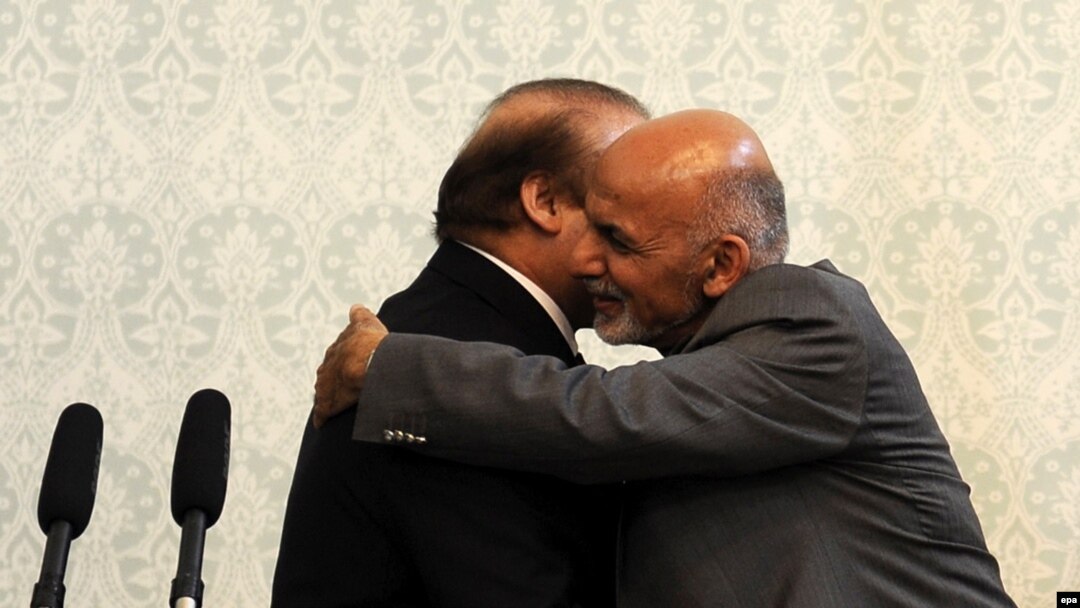 Pakistani Prime Minister Nawaz Sharif (left) and Afghan President Ashraf Ghani hug during Sharif's visit to Kabul on May 12.