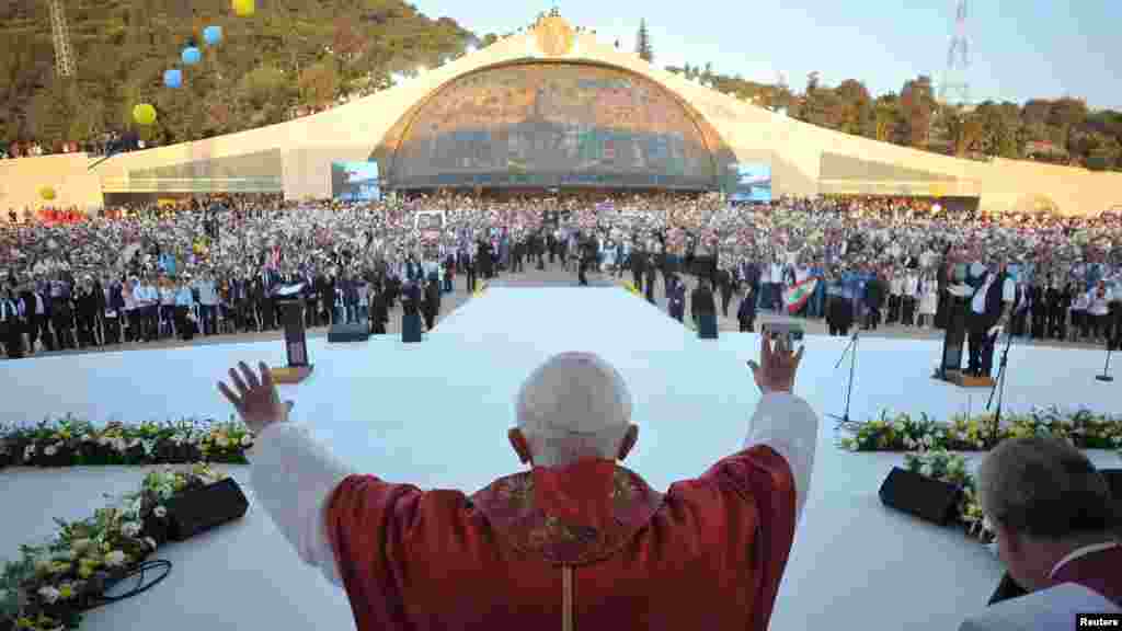 Pope Benedict waves as he arrives to attend a meeting with young people in Bkerke in Harissa, near Beirut, Lebanon, on September 15, 2012.