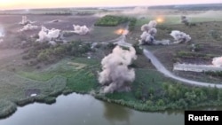 Drone footage from a Ukrainian drone shows what Kyiv's military says are artillery strikes on Russian troops east of Pokrovsk on August 21. 