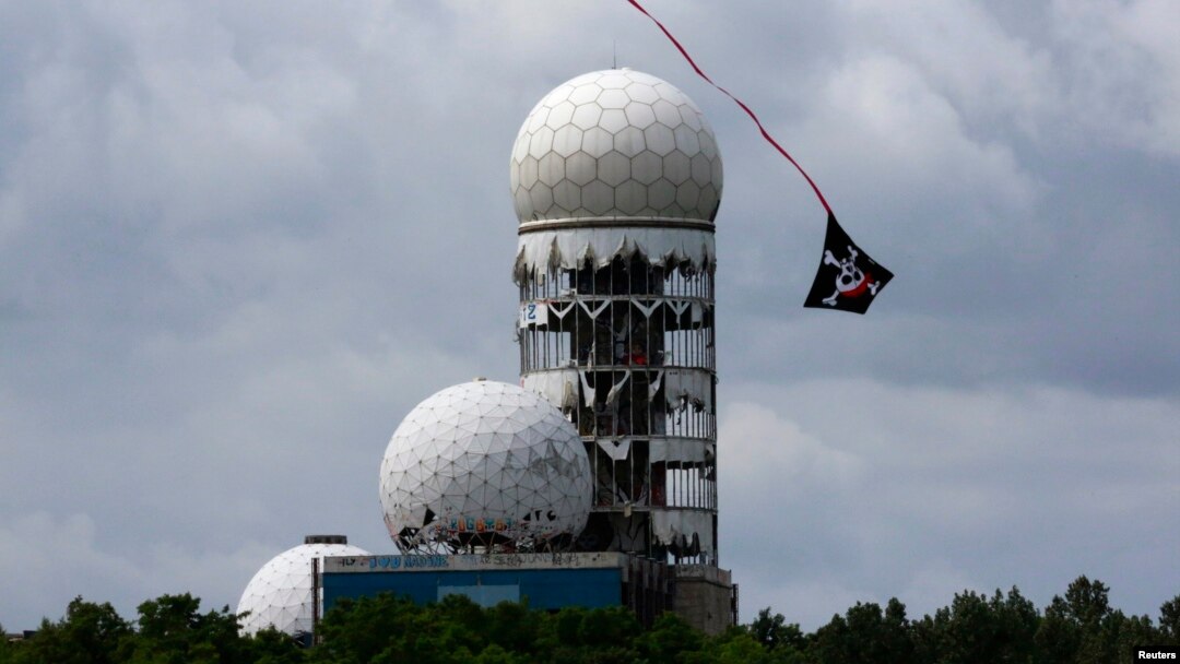 A kite flies near the antennas of a former U.S. National Security Agency Cold War listening post at Teufelsberg hill in Berlin.