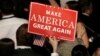 U.S. -- A Trump supporter holds up a campaign sign at Republican U.S. presidential nominee Donald Trump's election night rally in Manhattan, New York, U.S., November 9, 2016