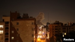 Smoke rises in Tehran following after strikes by the United States and Israel, which vowed to intensify attacks.