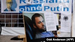 A poster with a photo of Zelimkhan Khangoshvili is seen during a protest outside the Russian Embassy in Berlin last year. 