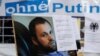 GERMANY -- A poster bearing a portrait of Georgian national Zelimahn Khangoshvili, who was shot dead by an alleged Russian operative in Berlin's Kleiner Tiergarten Park in August 2019, is seen during a protest against Russian president and government outs