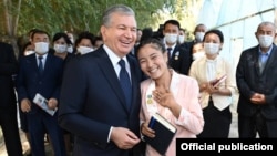 President Shavkat Mirziyoev (front left) visits Karakalpakstan's Bozatau district in September 2021.