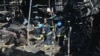 Співробітники ДСНС України розбирають завали у гіпермаркеті, зруйнованому внаслідок російського удару, Харків, Україна, 26 травня 2024 року 