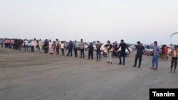 Residents for a human chain in Iran's Qeshm island to protest decision handing over tourism services to private sector. October 21, 2019