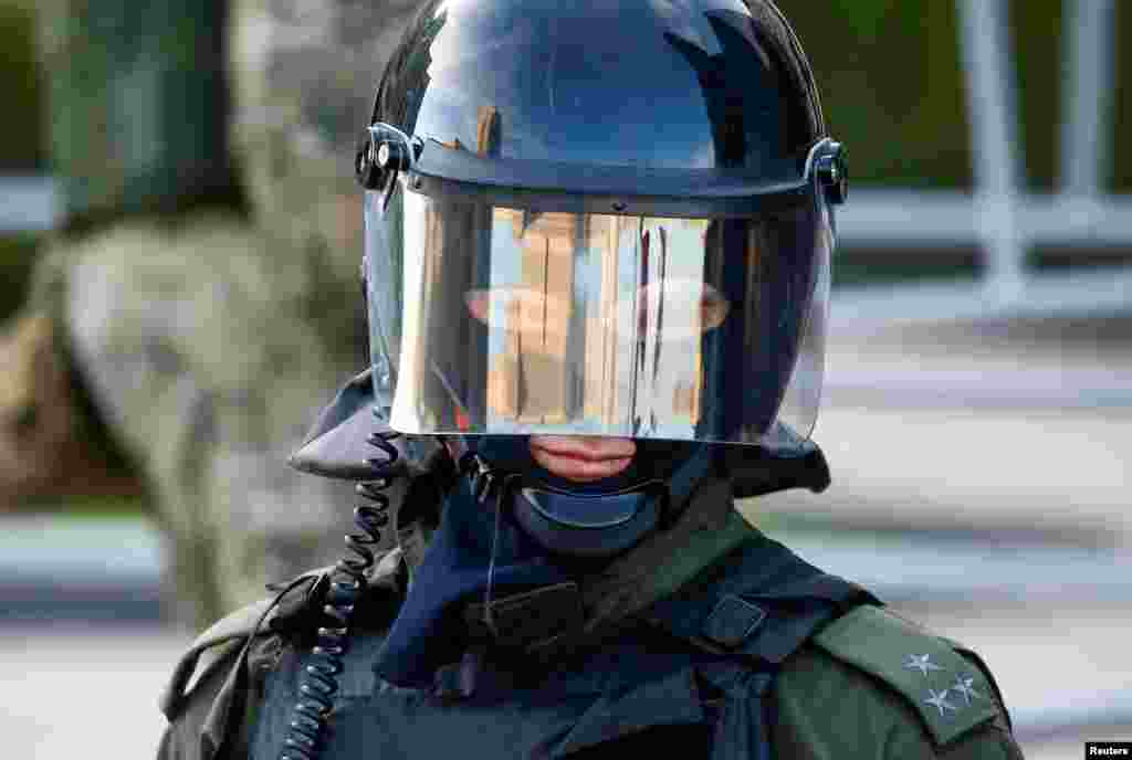 A Belarusian law enforcement officer looks on during an opposition demonstration against presidential election results in Minsk. (Reuters/Vasily Fedosenko)