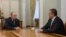 Russian President Vladimir Putin (left) meets with Crimean leader Sergei Aksyonov at the Novo-Ogaryovo state residence outside Moscow on April 14, where he named him acting governor.