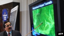 Alireza Jafarzadeh, the president of Strategic Policy Consulting, points to a monitor reportedly showing tunnels to a nuclear site during a press conference to present information on Iran’s new "major secret" nuclear site, Washington, D.C., on September 9