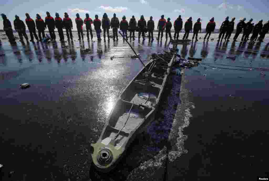 Russian Emergency Situations Ministry personnel work at the crash site of a Boeing 737-800 Flight FZ981 operated by Dubai-based budget carrier FlyDubai at the airport of Rostov-On-Don on March 20.