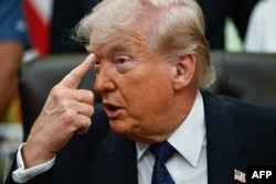 US President Donald Trump speaks to reporters at the Oval Office on May 5.