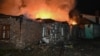 Fire burns at a house that was destroyed in a Russian drone strike in Kharkiv late on November 23, 2025, amid the Russian invasion of Ukraine.