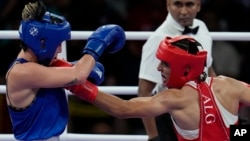 Algerian boxer Imane Khelif lands a left on Hungary's Luca Anna Hamori during their women's 66-kilogram quarterfinal women's boxing match at the Paris Olympics on August 3. 