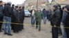 Armenia - A senior Russian army officer approaches a house in Gyumri where 6 people were killed by a gunman who Armenian police believe was one of his soldiers, 12Jan2015.