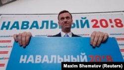 Russian opposition leader Alexei Navalny attends a meeting to uphold his bid for to run as a presidential candidate, in Moscow on December 24. 