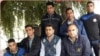 Iran - Haft Tapeh - Esmail Bakhshi (sitting C)after his release from prison among friends and coworkers. File photo
