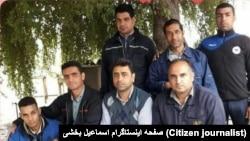 Iran - Haft Tapeh - Esmail Bakhshi (sitting C)after his release from prison among friends and coworkers. File photo