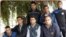 Iran - Haft Tapeh - Esmail Bakhshi (sitting C)after his release from prison among friends and coworkers. File photo