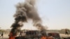 IRAQ -- Iraqi protesters burn tires and block the road at the entrance to the city of Basra, Iraq July 12, 2018. 