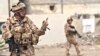 Iraq -- British soldiers patrol on the street in Al-Basrah, 27Feb2009