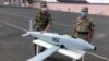 File photo: Armenian officers demonstrate an Israeli-made "suicide" drone SkyStriker which they say was intercepted during fighting with Azerbaijani forces, July 24, 2020.