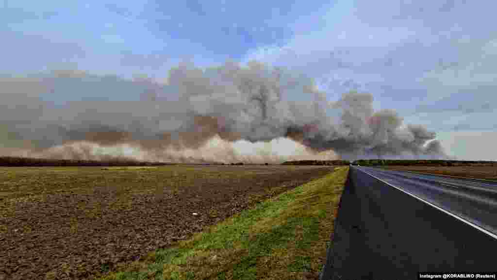 Smoke rises from the site of a fire at an ammunition depot in Russia&#39;s Ryazan region. (Courtesy of Instagram @KORABLINO/Social Media via Reuters)